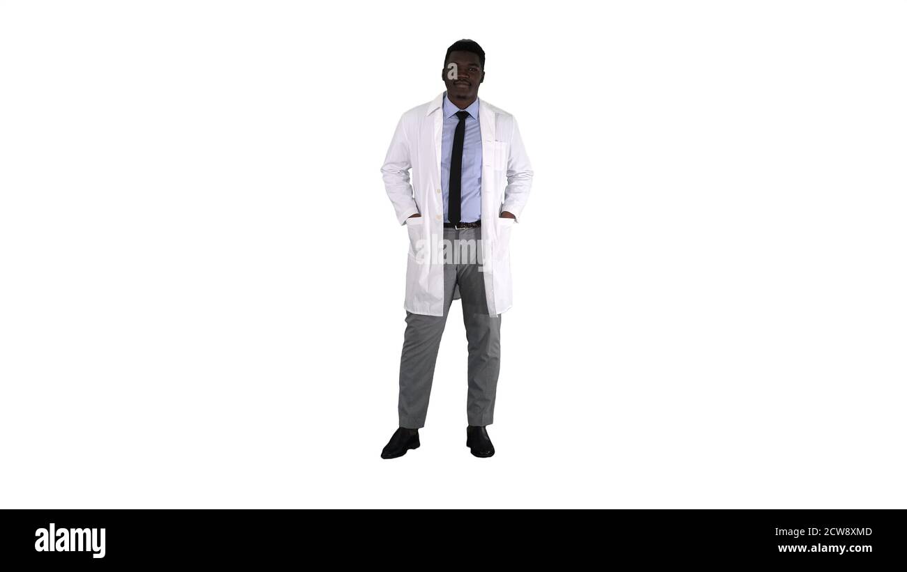 Male African Doctor Standing With Hands In His Pockets on white Stock Photo