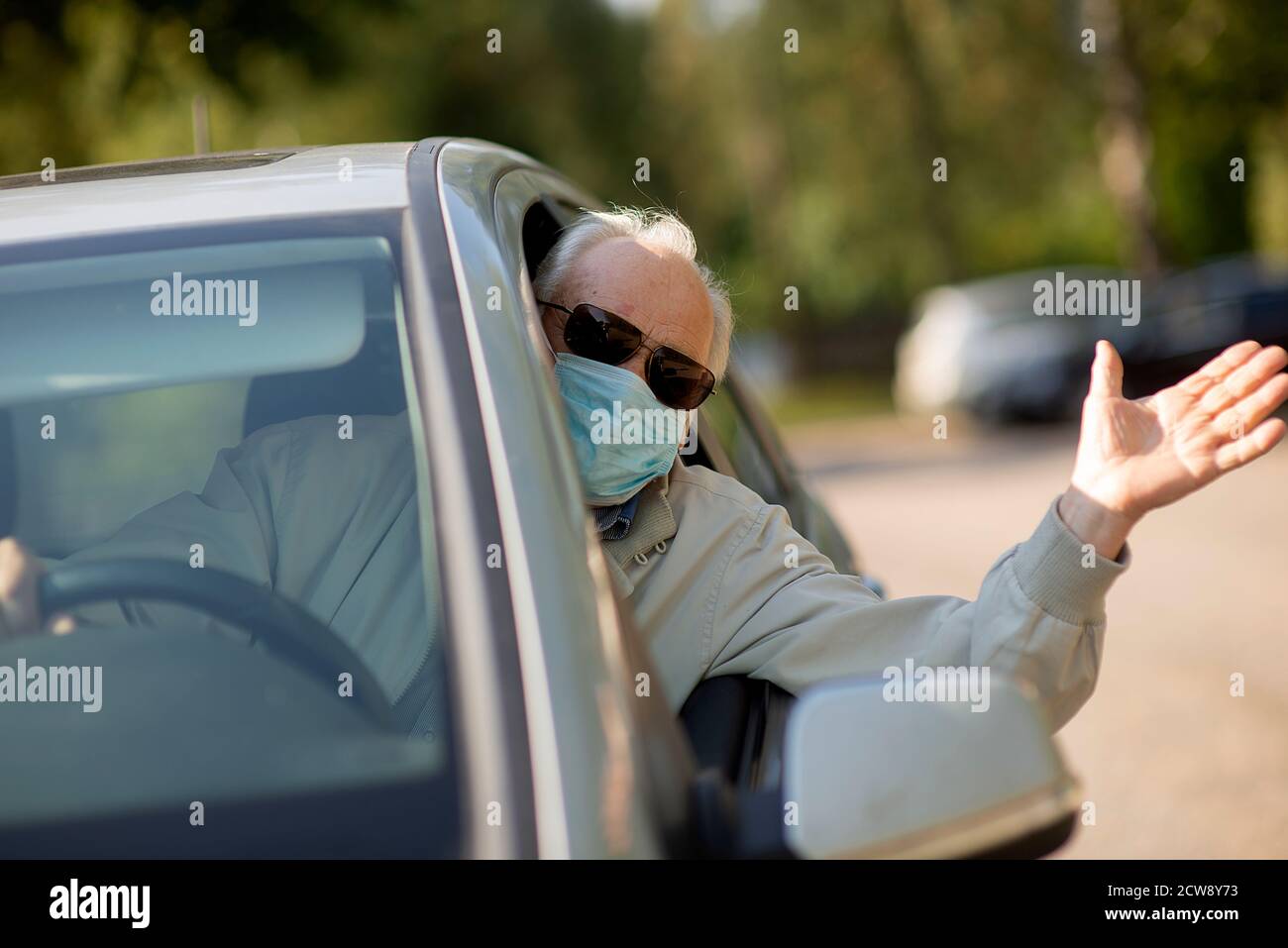 Elderly man driving car hi-res stock photography and images - Alamy