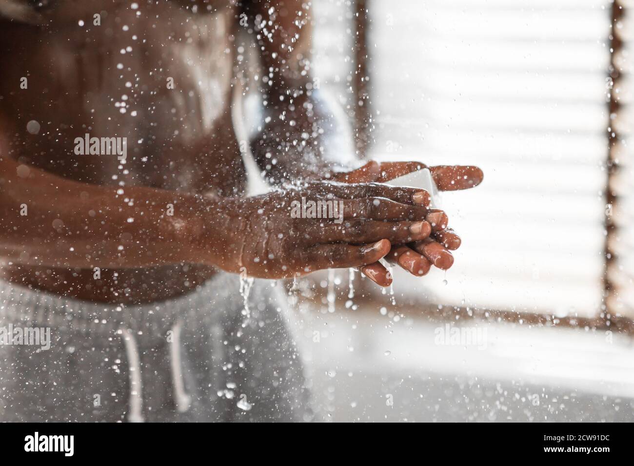 Guy washing his hands hires stock photography and images Alamy