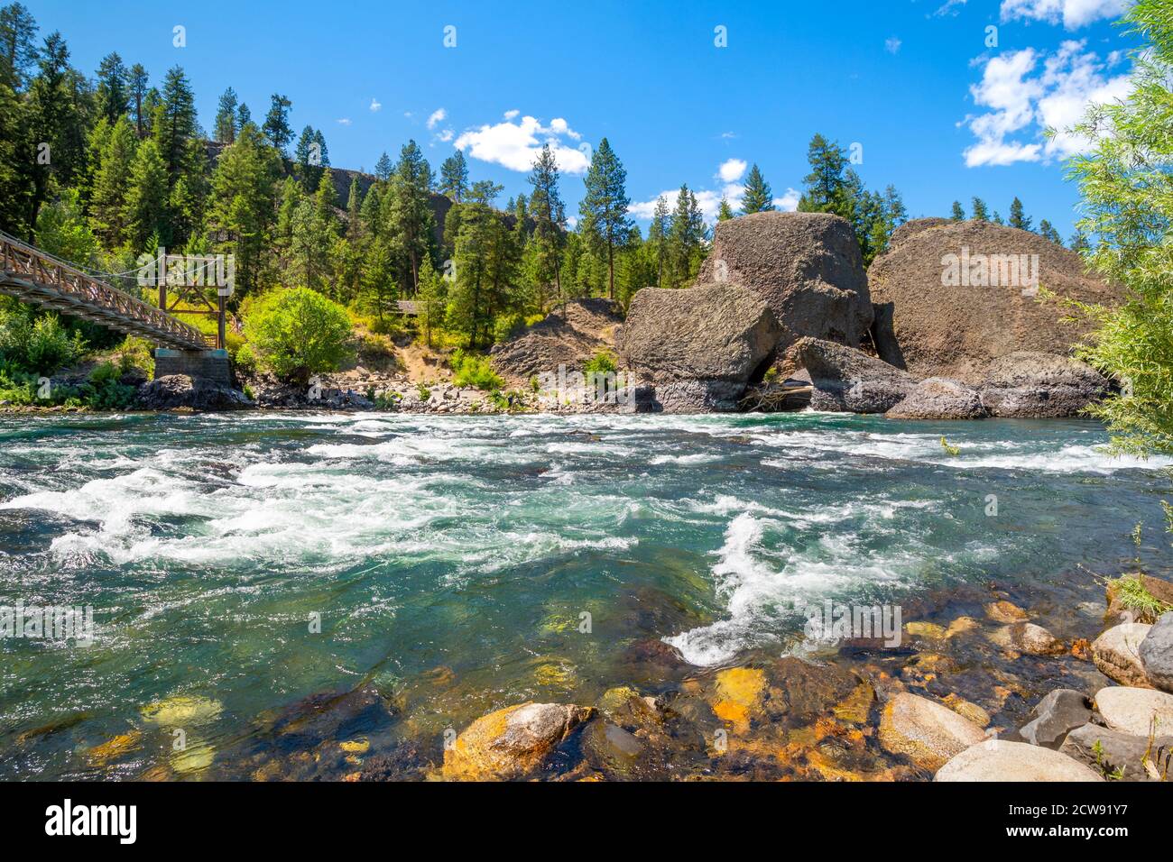 The wooden suspension bridge over the Spokane River at the Bowl and