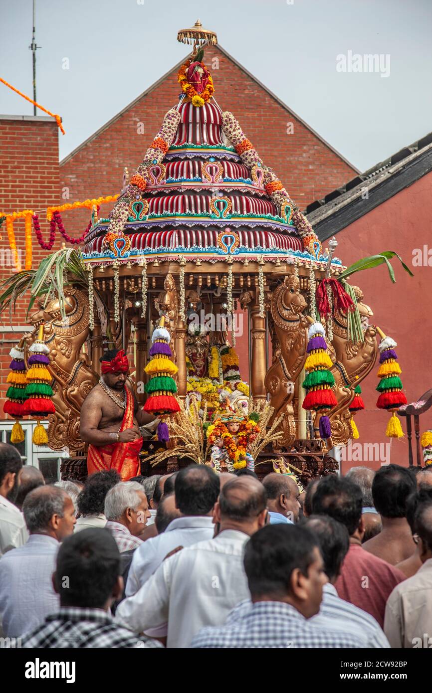 Several thousand people took part in annual procession around the local streets from the Shree Ganapathy Hindu Temple in Wimbledon, Southwest London. Stock Photo