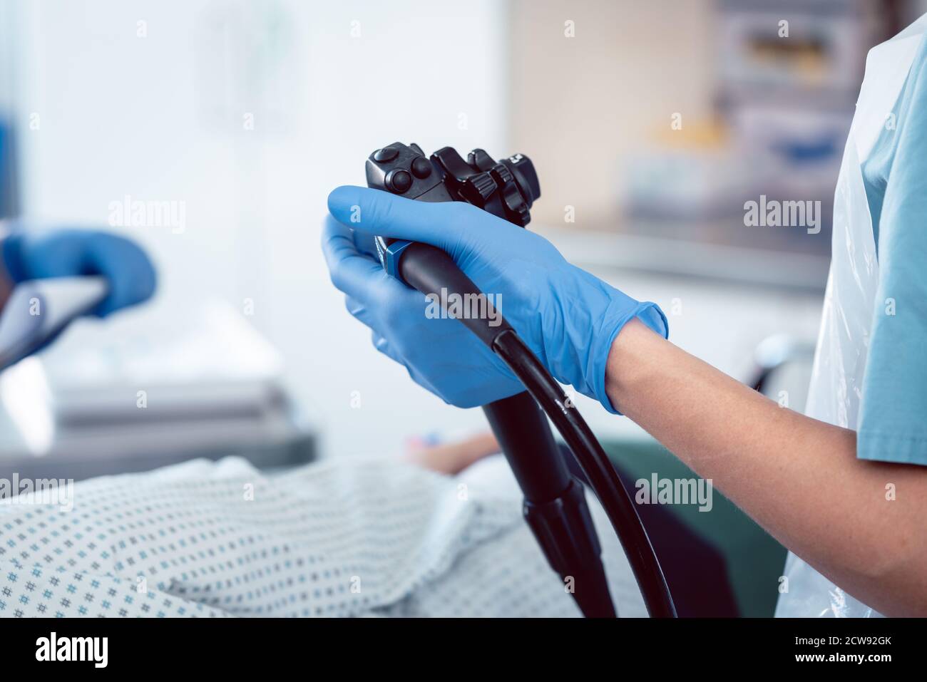 Doctor holding endoscope during colonoscopy Stock Photo - Alamy