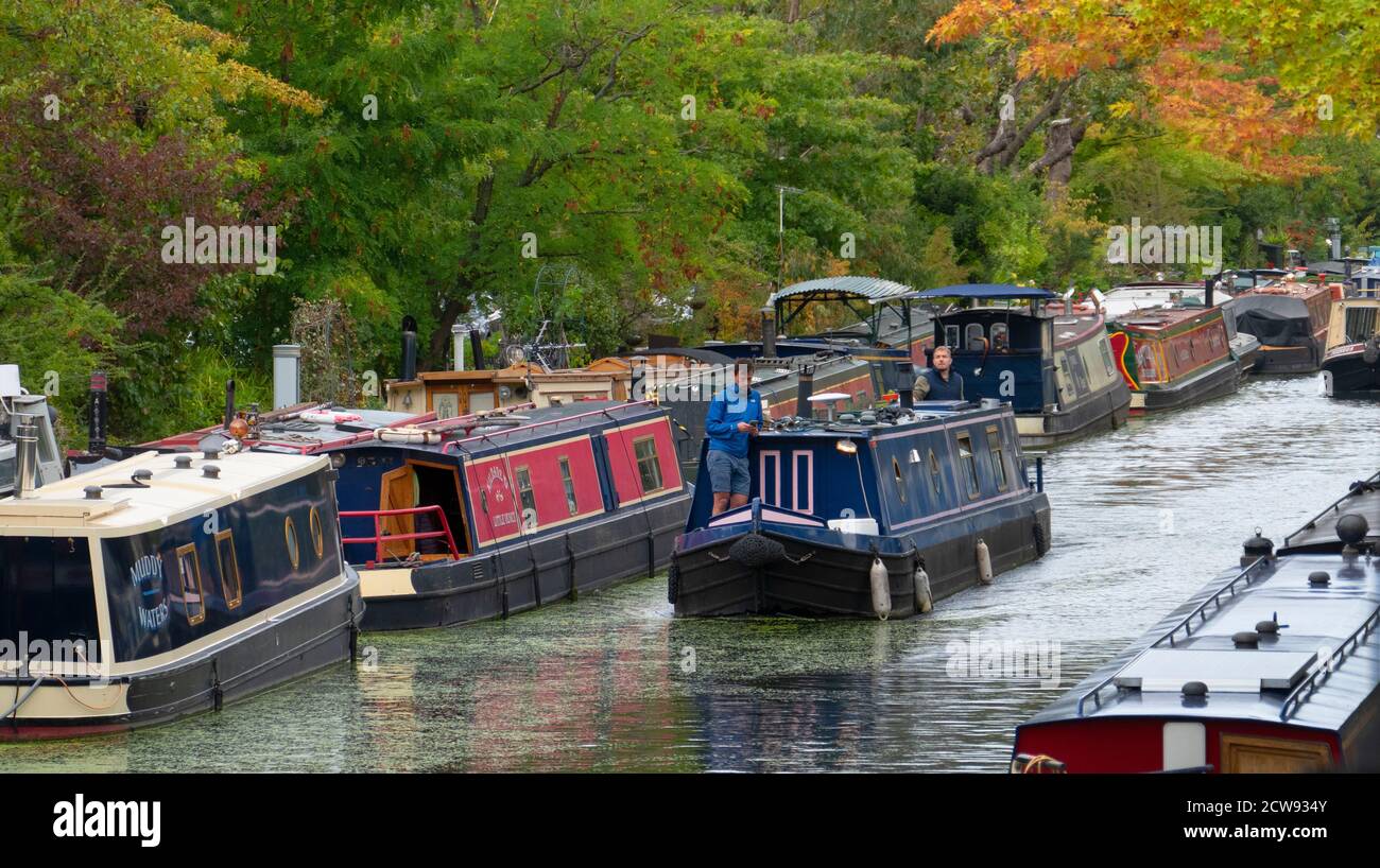 Picturesque narrow boats at Little Venice in London, England. Pretty house boats are moored on the canals near Maida Vale. A popular location for tour Stock Photo