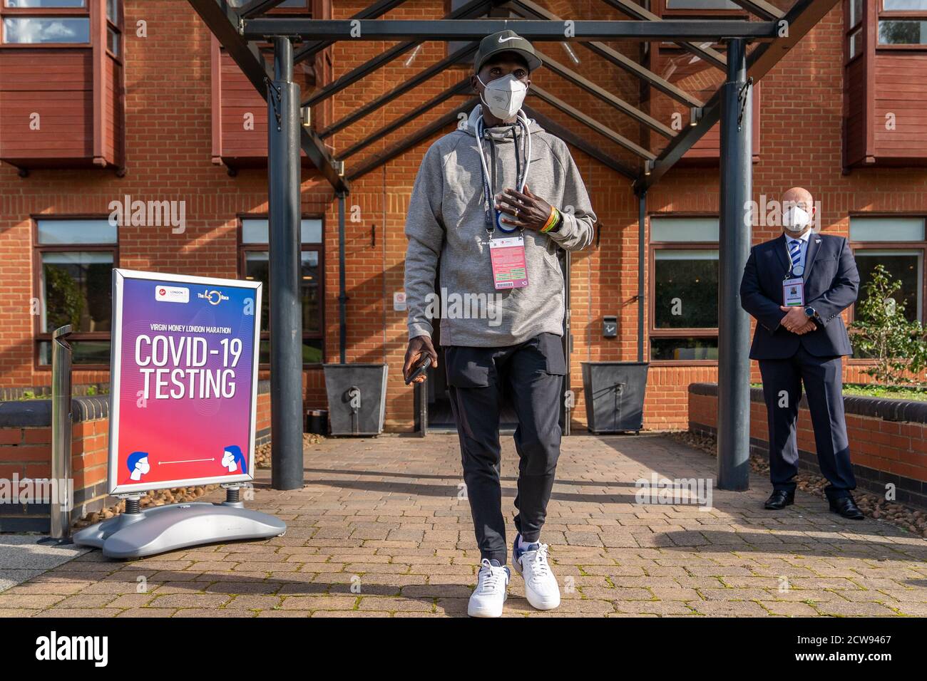 Kenya's Eliud Kipchoge walks out of the COVID-19 testing area after arriving at the official hotel and entering the biosecure bubble for the historic elite-only 2020 Virgin Money London Marathon on Sunday 4 October. The 40th Race will take place on a closed-loop circuit around St James’s Park in central London . Stock Photo