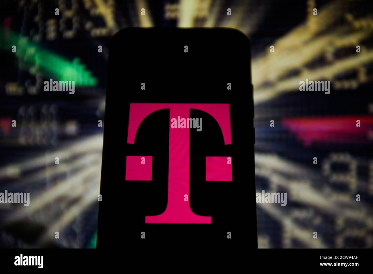 In this photo illustration a T Mobile logo is seen displayed on a ...