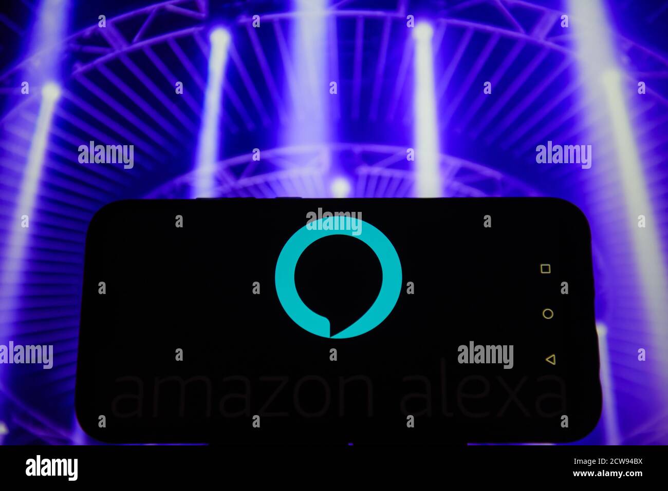 In this photo illustration an Amazon Alexa logo is seen displayed on a