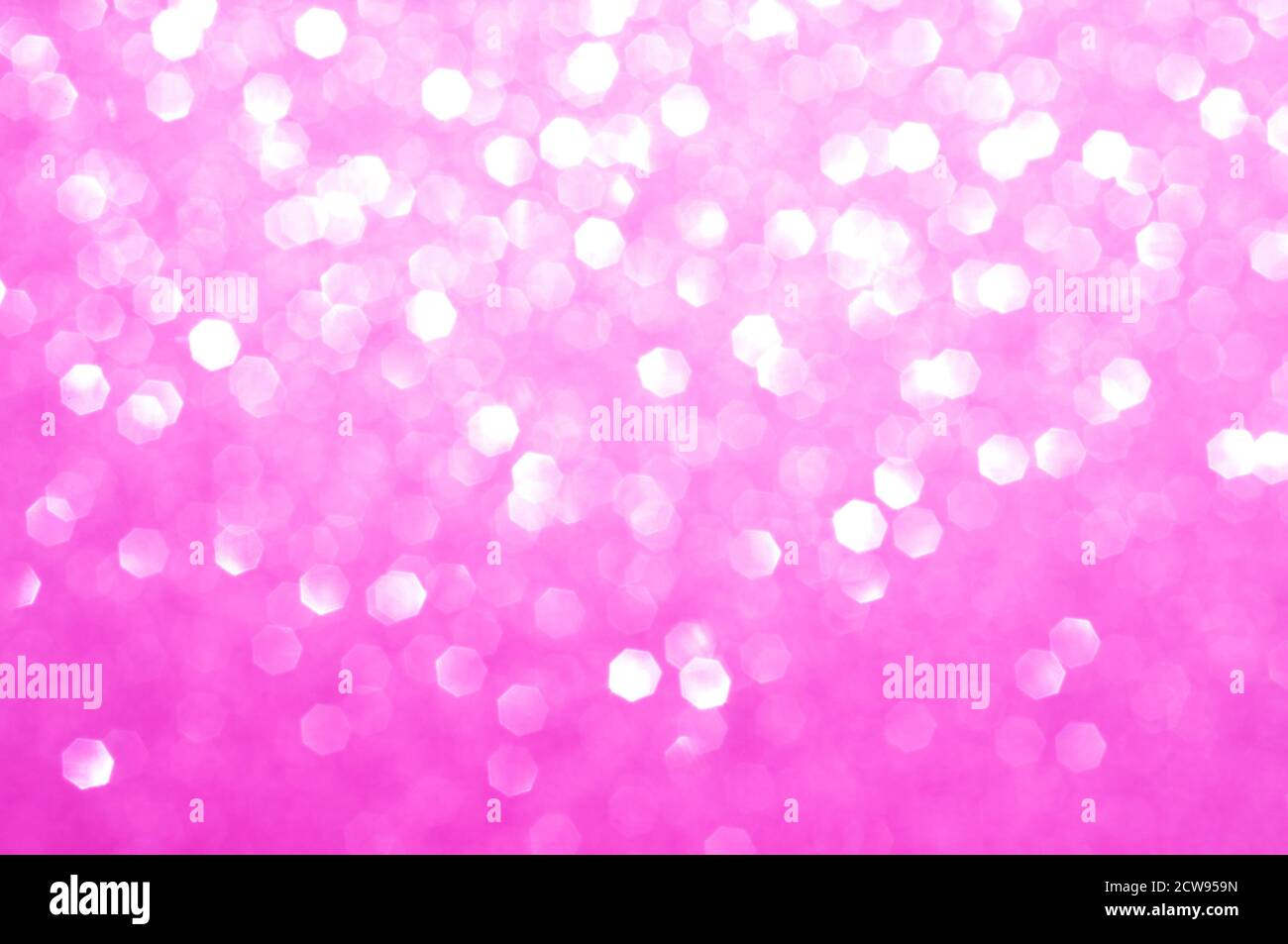 Colorful abstract blurred pink background, fuchsia glitter texture