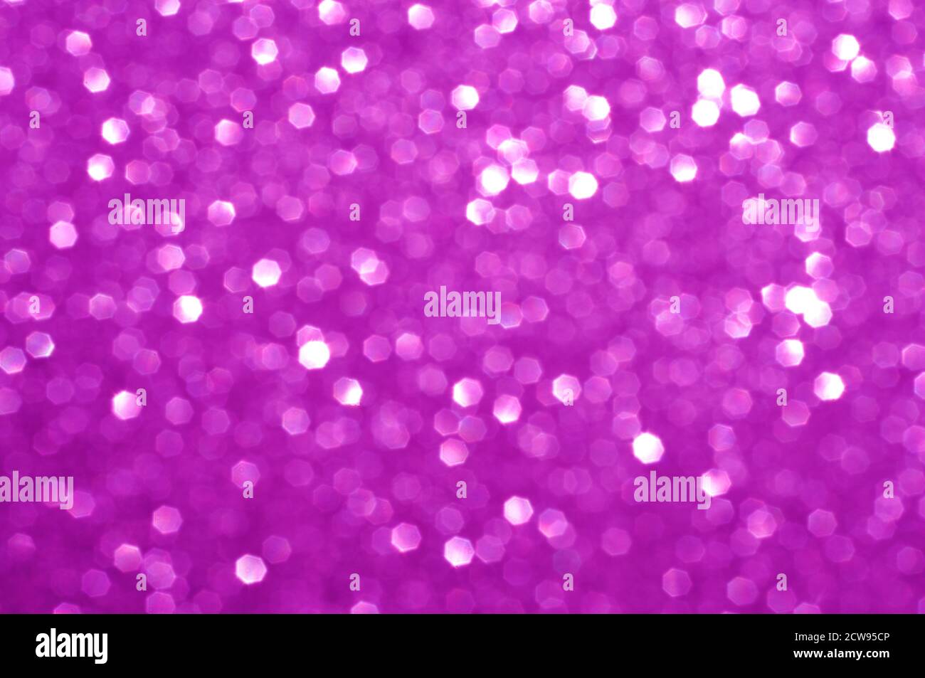 Colorful abstract blurred pink background, fuchsia glitter texture