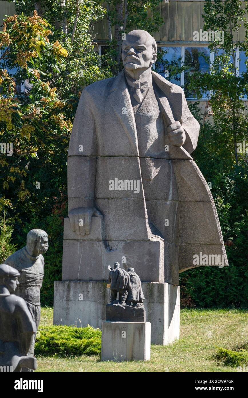 Large Lenin statue made in 1971 by Lev Kerbel dwarfs the rest of sculptures and dominates the landscape at Museum of Socialist Art in Sofia Bulgaria Stock Photo