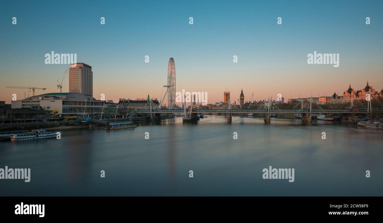 Sunrise over the London Eye and Big Ben seen from Waterloo Bridge, London, United Kingdom Stock Photo