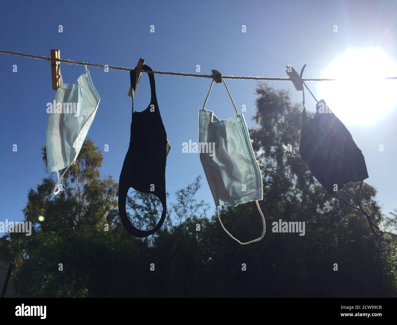 face masks on washing clothes line reusable and washed masks for