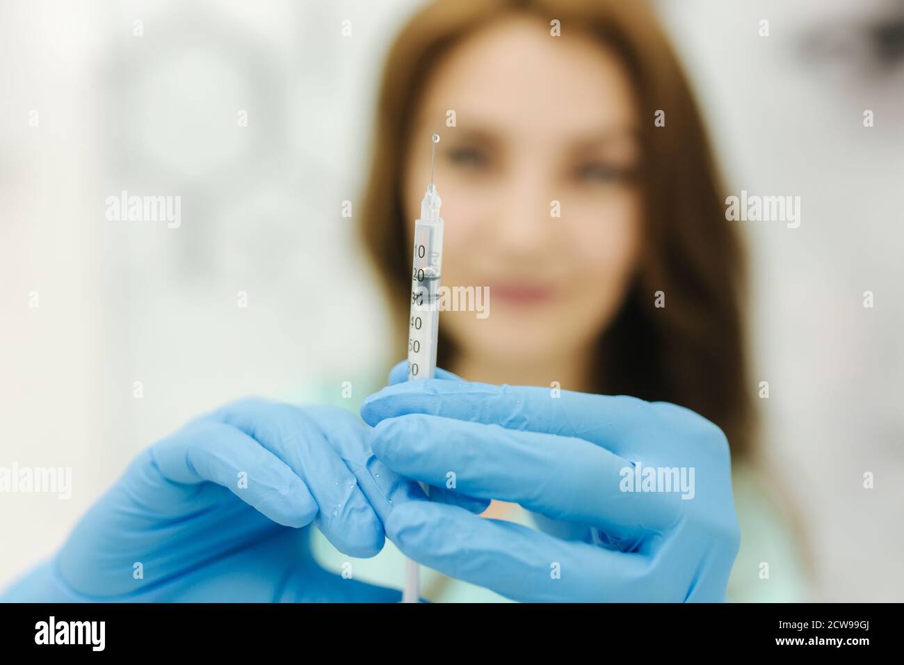 Cosmetologyst hold syringe in hand. Injection. Medical clinic Stock ...