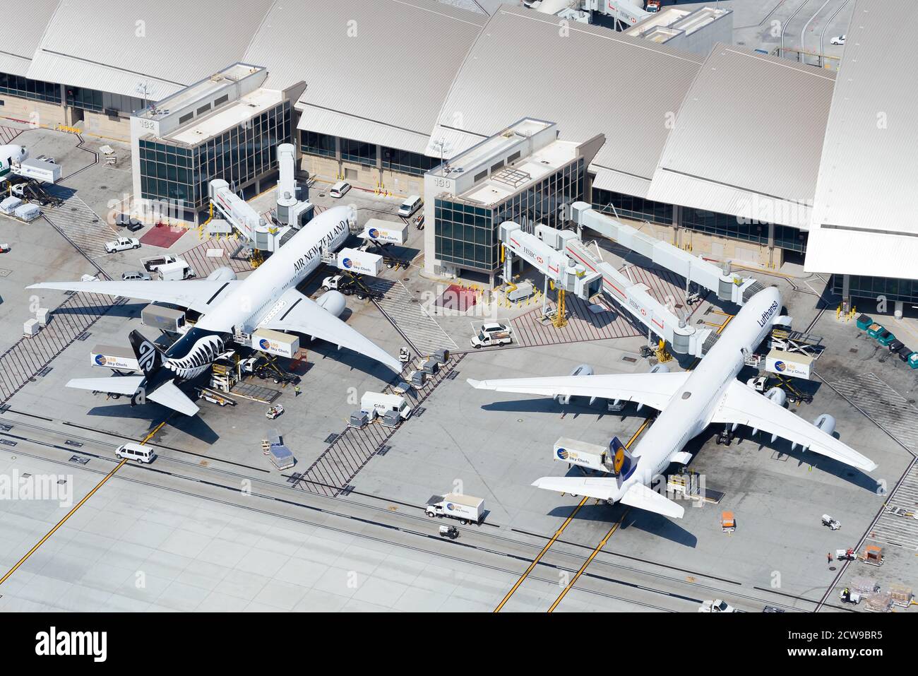 Aerial view of Tom Bradley International Terminal with Air New Zealand and Lufthansa side by side. TBIT Terminal at LAX Airport. Stock Photo