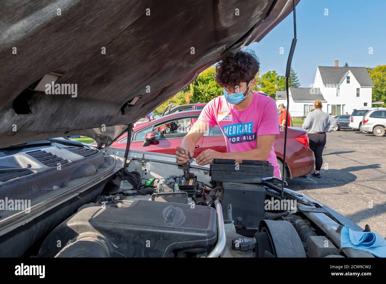 Ypsilanti, Michigan - Professional and amateur auto mechanics made free car repairs at a Pull Over Prevention Clinic. The event aimed to help communit Stock Photo