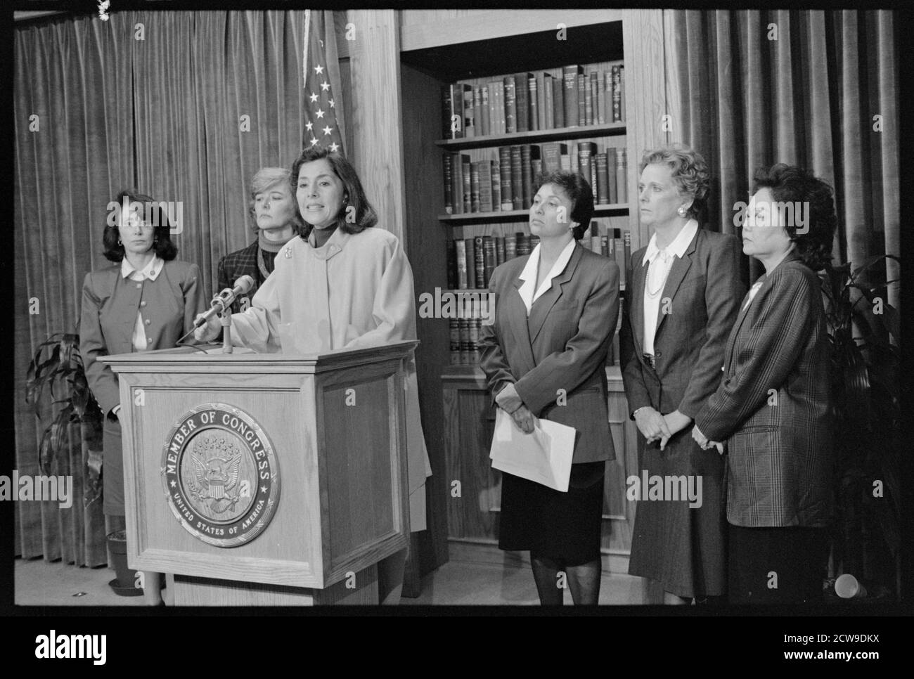Representatives (l-r) Nancy Pelosi, Patricia Schroeder, Barbara Boxer (at podium), Nita Lowey, Marilyn Lloyd and Patsy Mink at press conference condemning President George H.W. Bush's veto of civil rights legislation, Washington, DC, 10/22/1990.  (Photo by Michael R Jenkins/CQ Roll Call Photograph Collection/RBM Vintage Images) Stock Photo