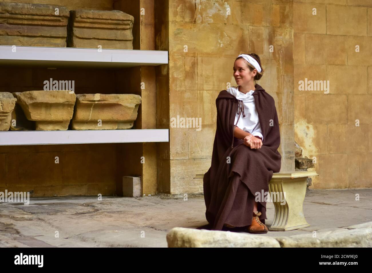 A woman in Roman costume at Roman Baths in the city of Bath, England ...