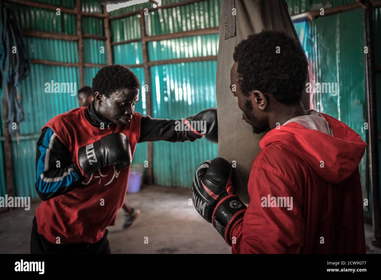 18 year old Muhhamed Hussein (L) alongside his fellow team mate Ahmed Abdalla (R) are seen challenging each other in a boxing match at the local Gym space in Kibera.Kenya well known