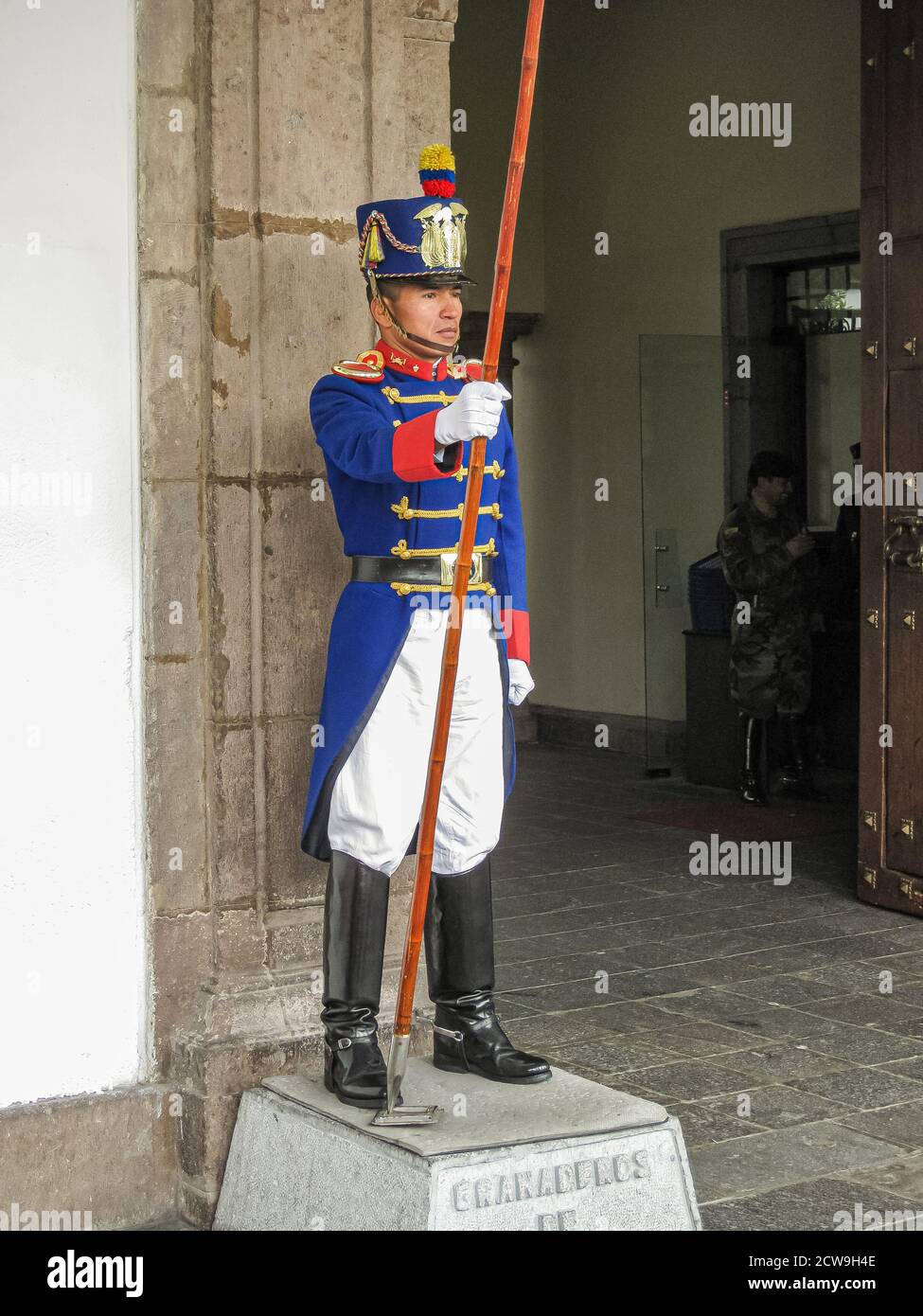 Quito, Ecuador - December 2, 2008: Closeup of 1 of Granaderos de Tarqui, as guard at entrance of Presidential Carondelet Palace. Black boots, blue ves Stock Photo