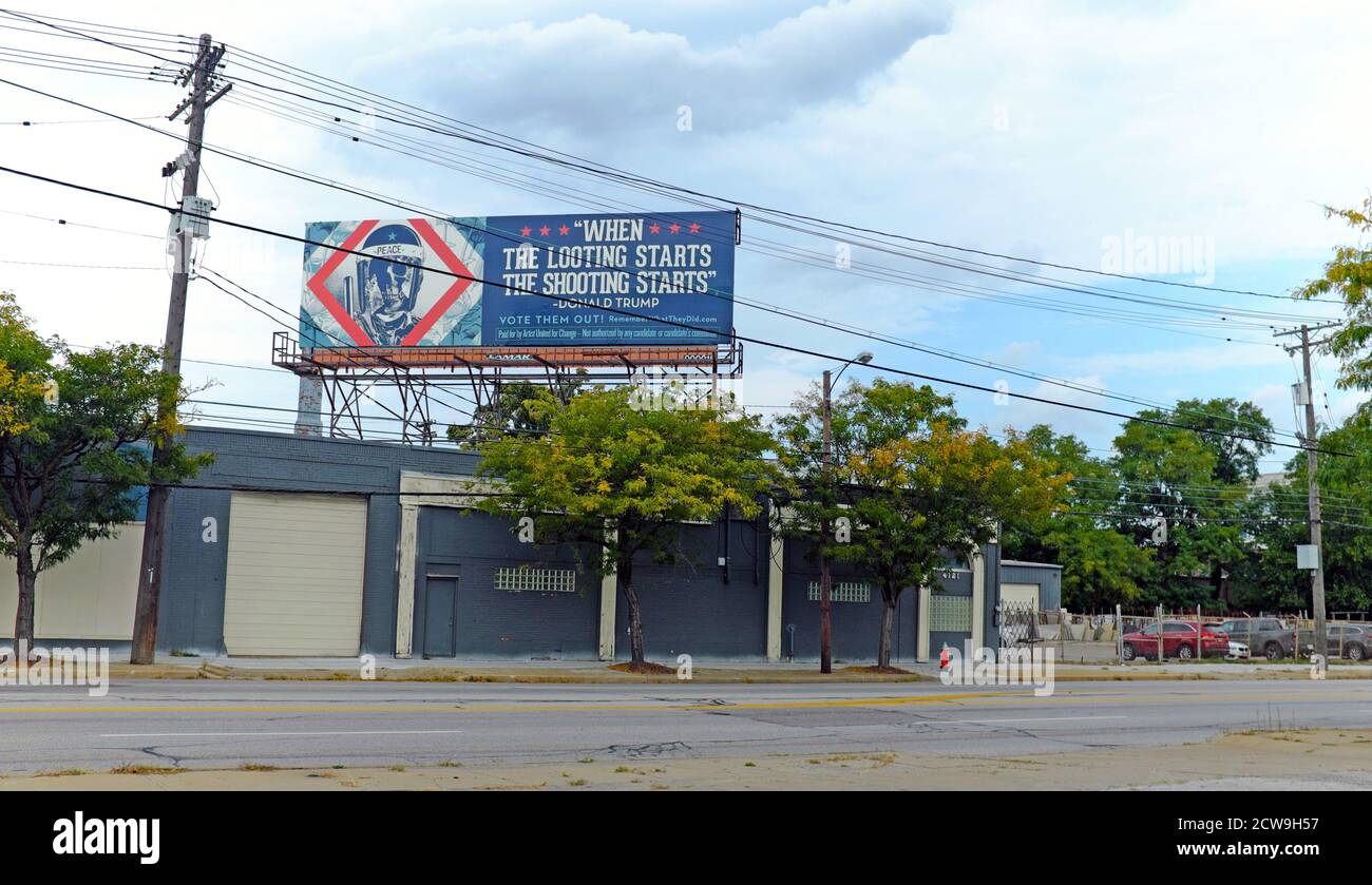 Billboard by Artists United for Change, an art-based super PAC, heralds an anti-Trump message near the corner of Carnegie and 40th Street in Cleveland, Ohio, USA.  The bilboard, one of many strategically placed throughout the Cleveland area in the run-up to the first 2020 Presidential Debate to be held in Cleveland, is part of the 'Vote Them Out' campaign and 'Remember what they did' campaign.  The political bilboards carry different messages relying on quotes Trump and other politicians have made regarding immigration, children held in cages at the border, the pandemic response, and others. Stock Photo