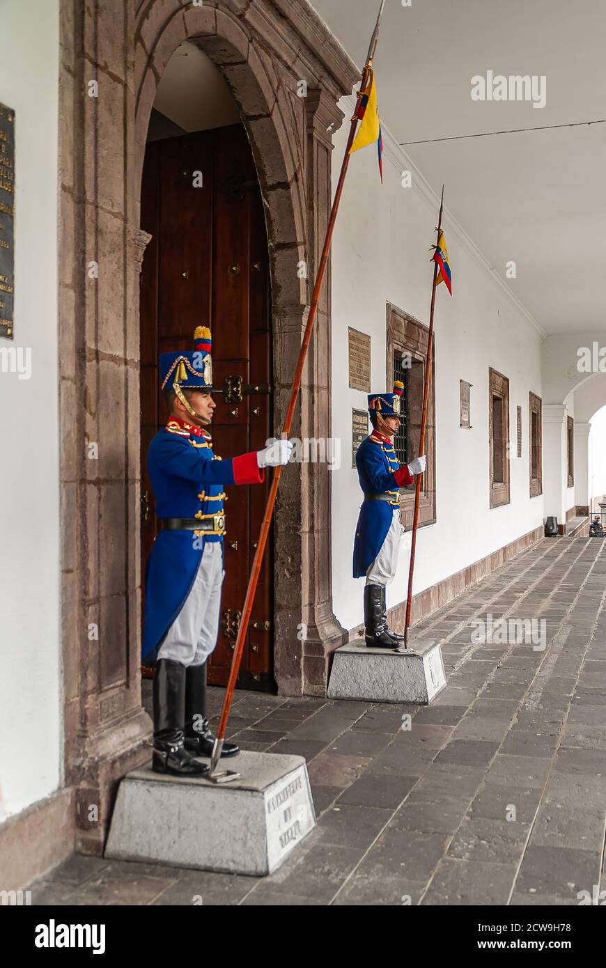 Quito, Ecuador - December 2, 2008: 2 Granaderos de Tarqui, as guard at entrance of Presidential Carondelet Palace. Black boots, blue vest, white pants Stock Photo