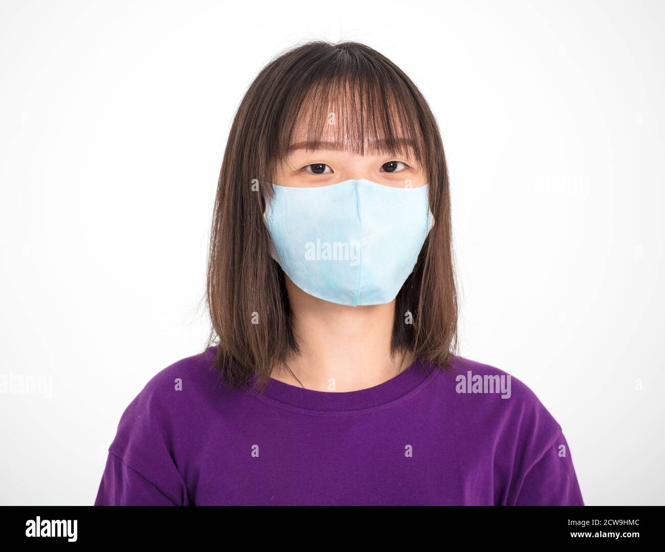 Asian teenager girl wearing medical face mask Stock Photo