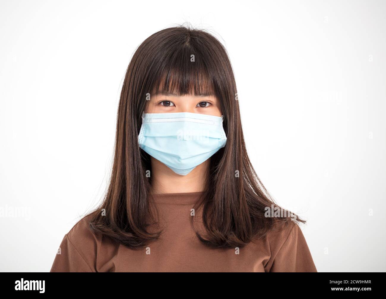 Asian teenager girl wearing medical face mask Stock Photo