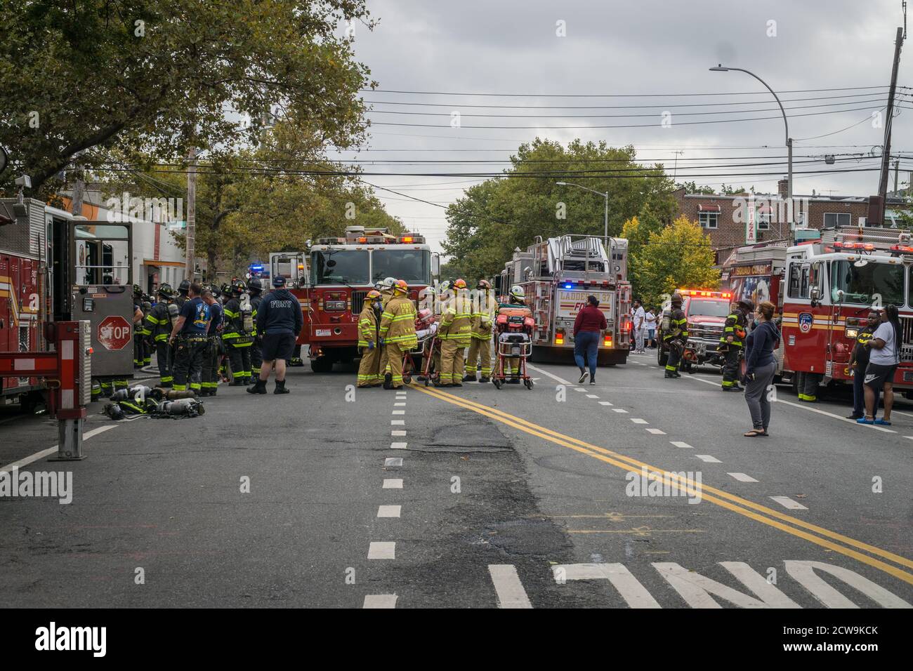 New York City Fire fighters rescue three children from a burning ...