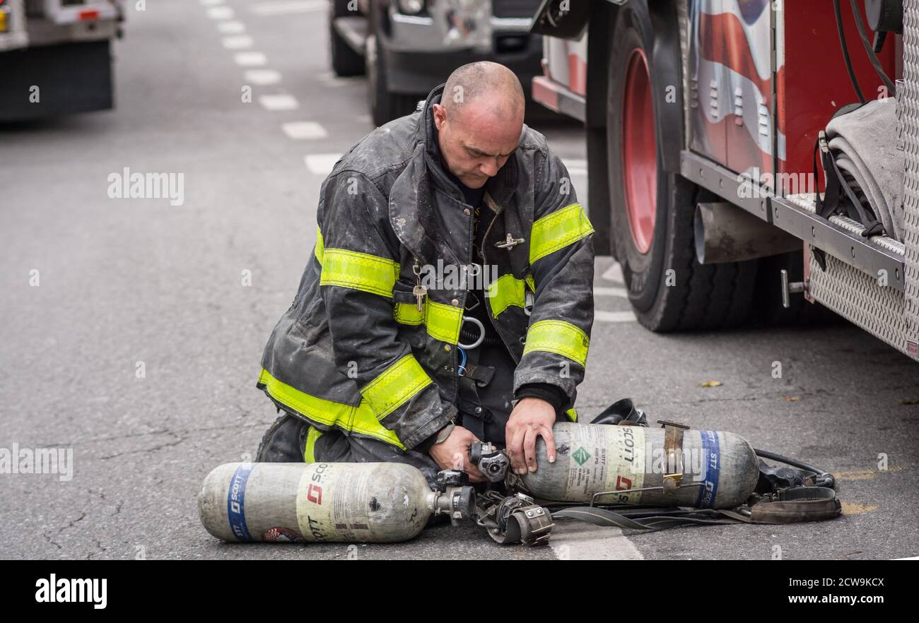 New York City Fire fighters rescue three children from a burning ...