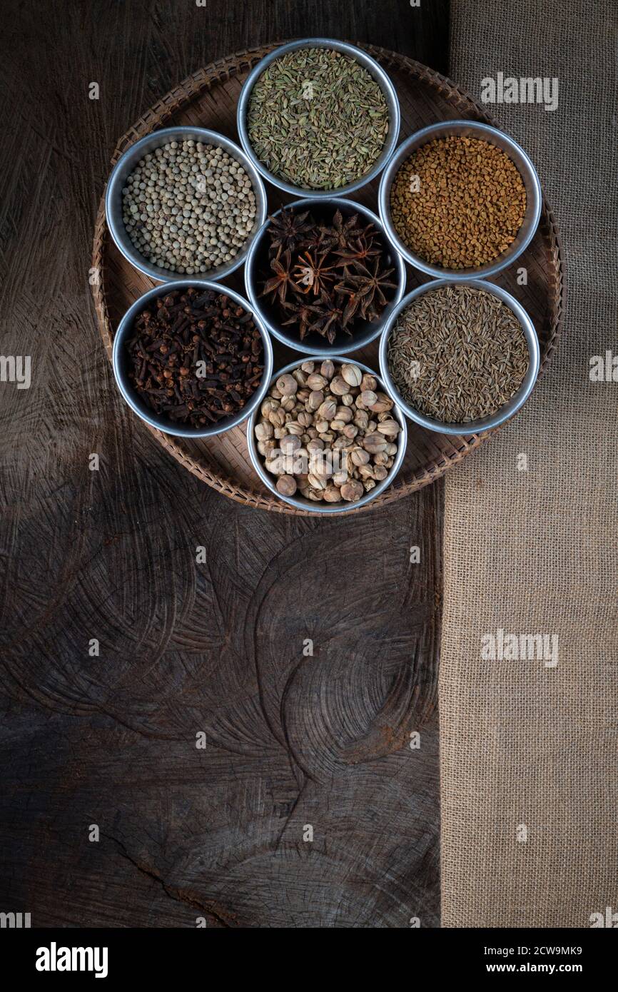 Condiment of indian food Spice garnish background on wood table top
