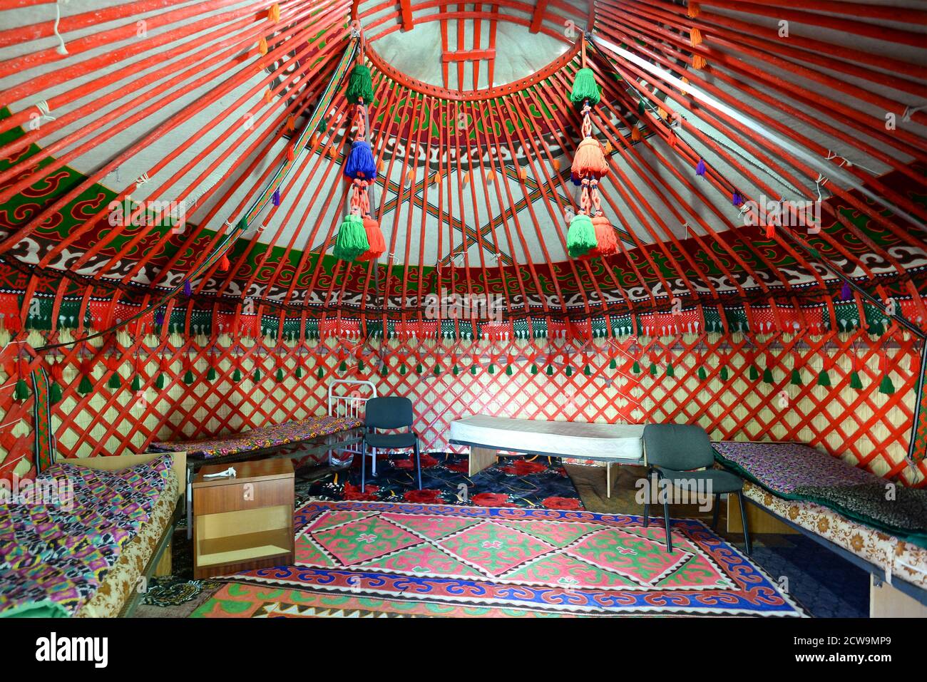 Inside view of a yurt in Bokonbayevo, Kyrgyzstan. Circular tent used as a house by dungan and nomadic groups in Central Asia. Ger interior. Stock Photo