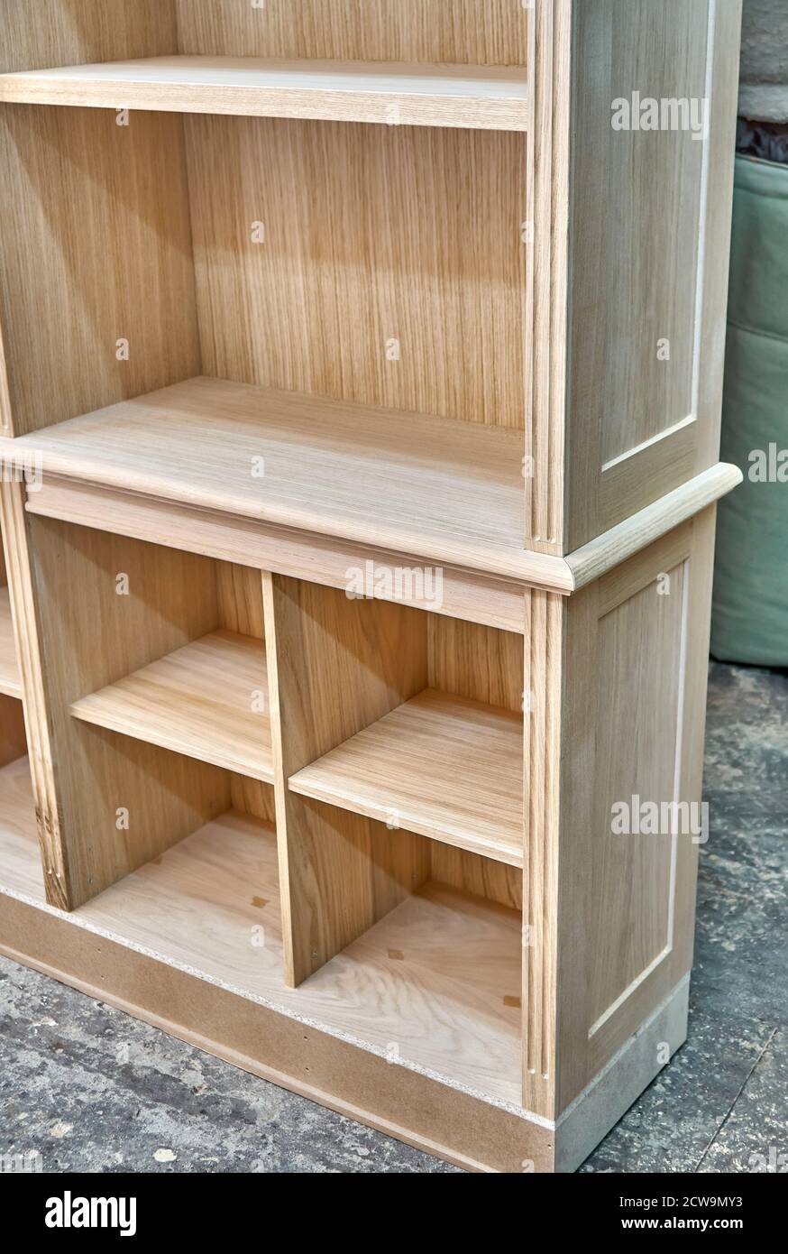 Modern joinery. Wooden bookcases in process of production in workshop. Furniture manufacture. Close-up Stock Photo