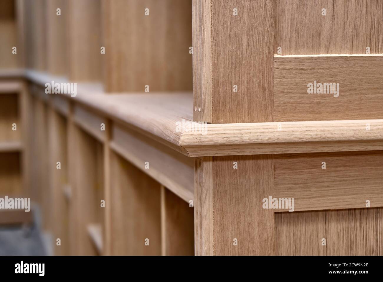 Modern joinery. Wooden bookcases in process of production in workshop. Furniture manufacture. Close-up Stock Photo