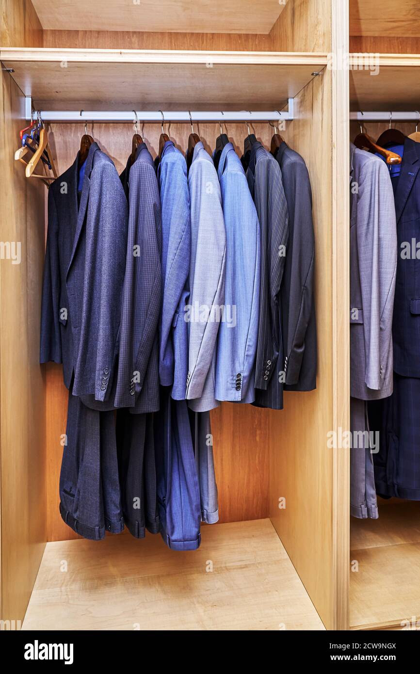 Boy clothes on hangers in the wardrobe Stock Photo - Alamy