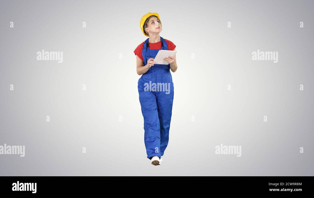Woman construction worker with tablet checking construction site Stock Photo