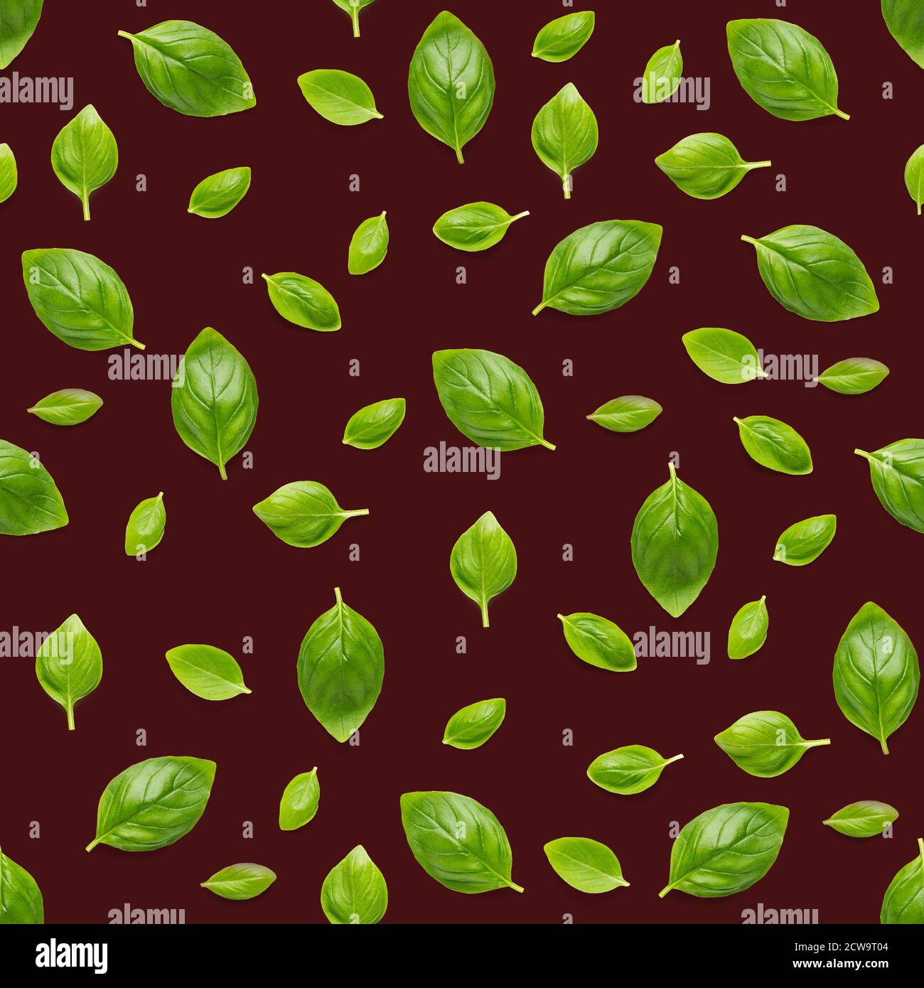 Italian Basil leaf herb seamless pattern on red background, Creative seamless pattern made from fresh green basil flat lay layout. Stock Photo