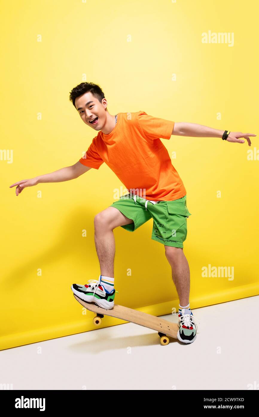 Skateboarding young man Stock Photo Alamy