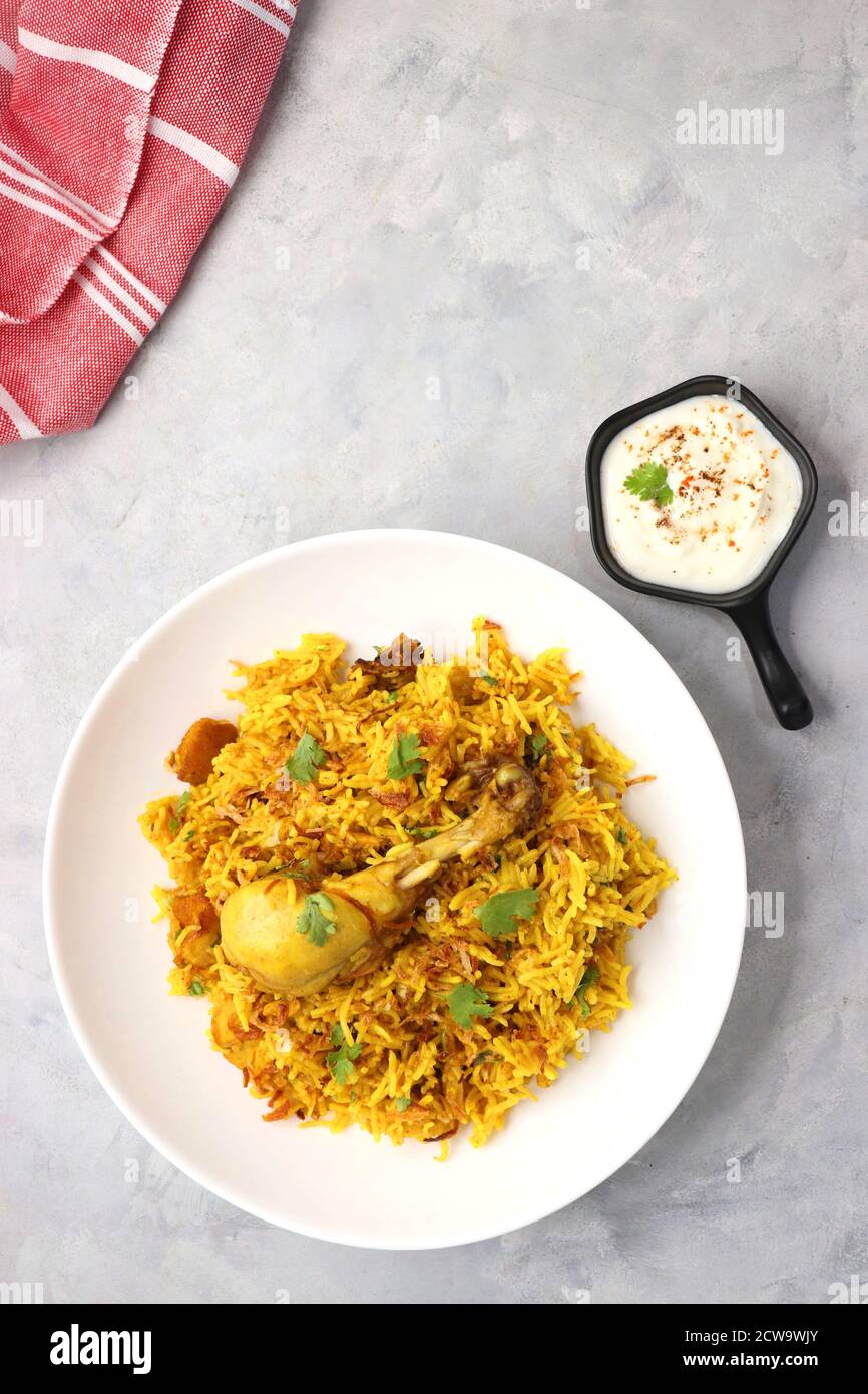 Chicken Biryani, Chicken Pulav. Garnished with fried onion & coriander