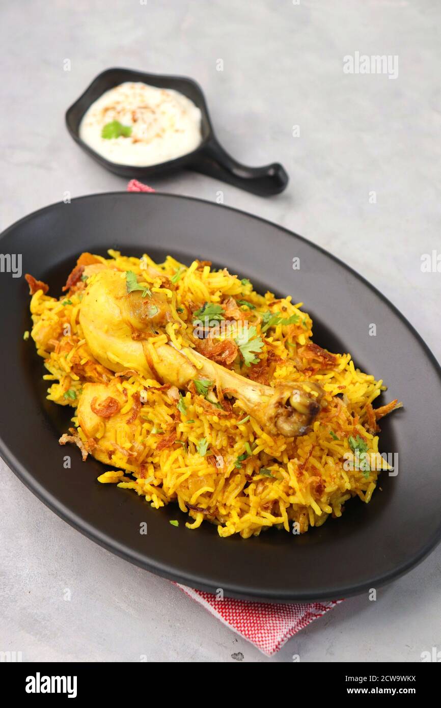 Chicken Biryani, Chicken Pulav. Garnished with fried onion & coriander