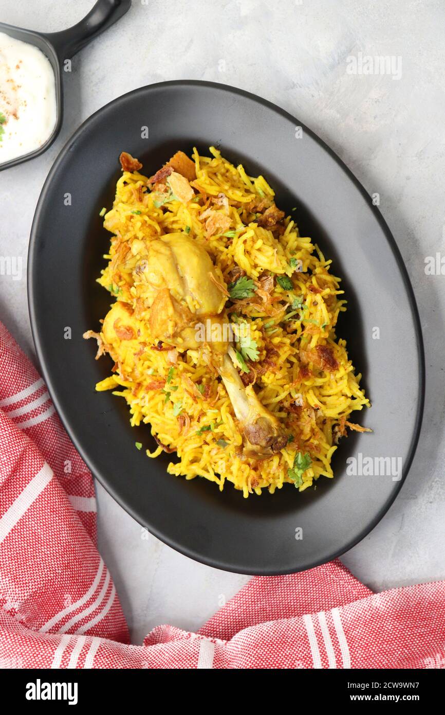 Chicken Biryani, Chicken Pulav. Garnished with fried onion & coriander