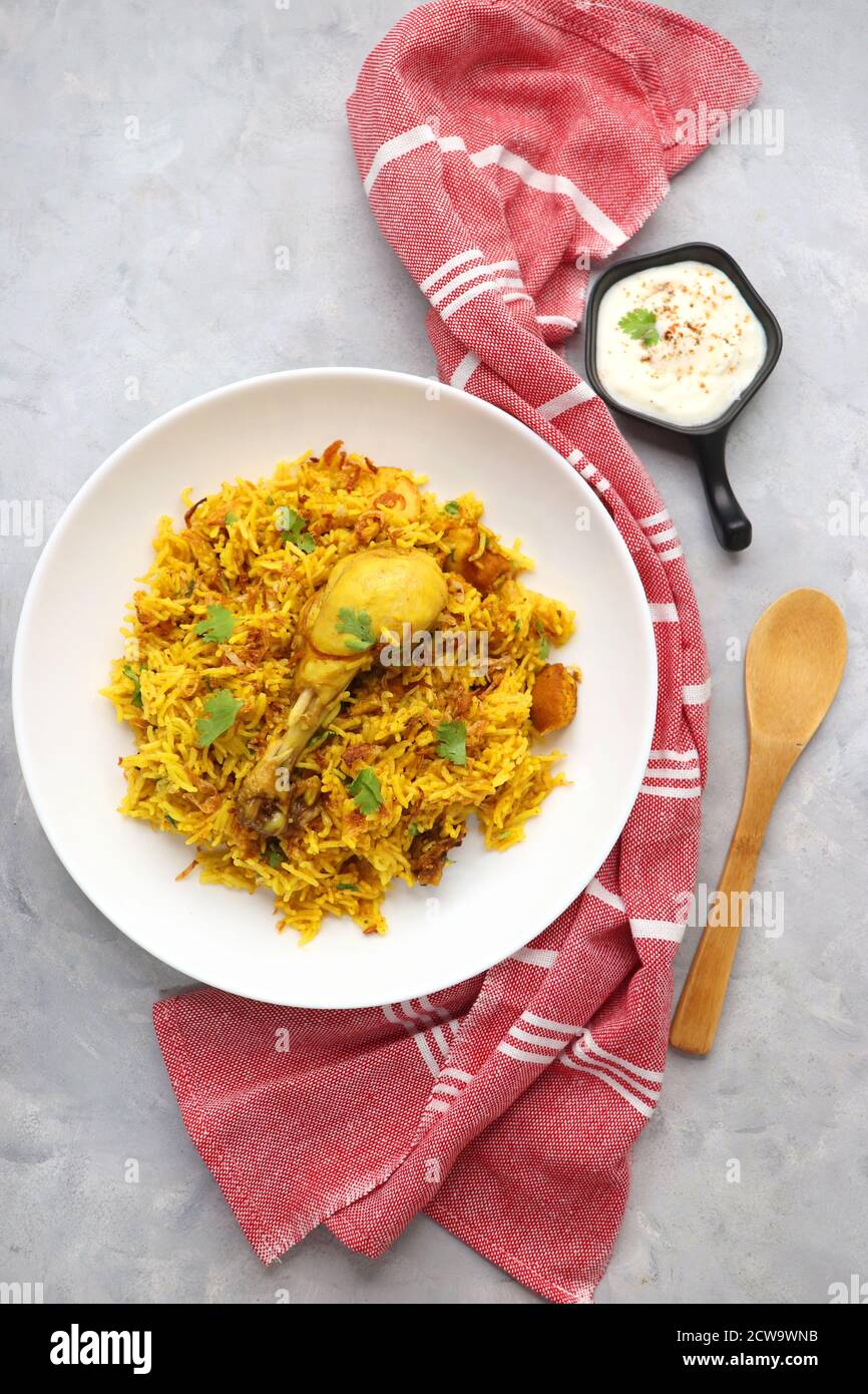 Chicken Biryani, Chicken Pulav. Garnished with fried onion & coriander
