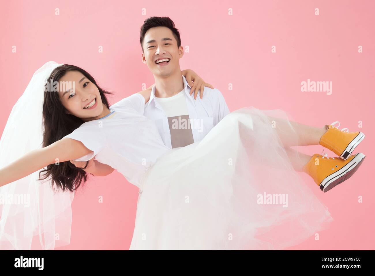 Happy young man picked up his girlfriend Stock Photo
