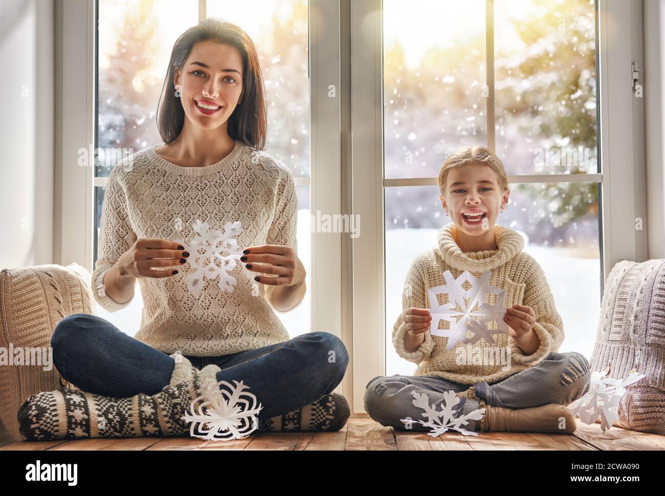 Merry Christmas and happy holidays! Happy loving family sitting by the ...