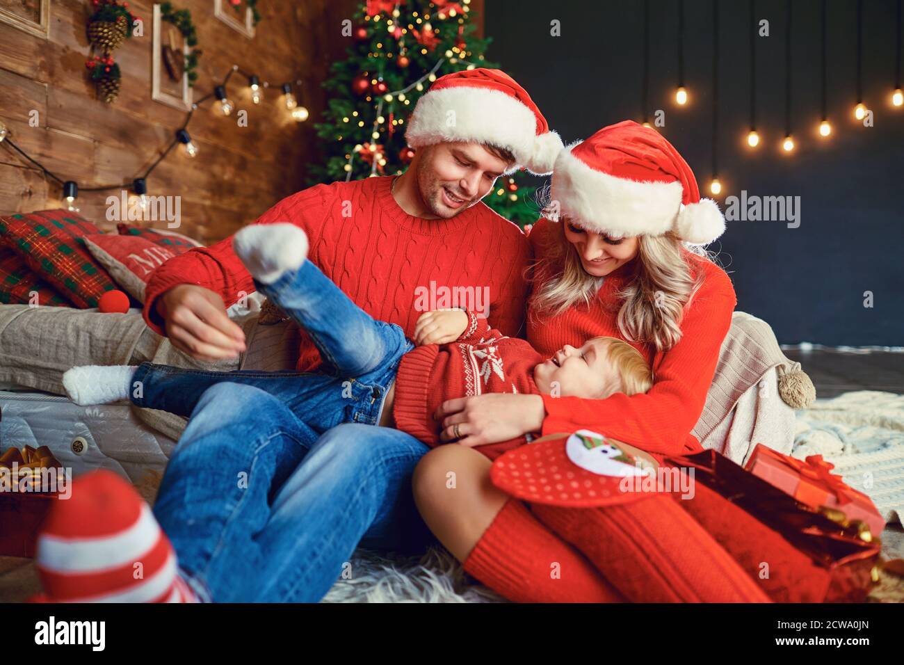 Family playing together in a room at Christmas. Stock Photo