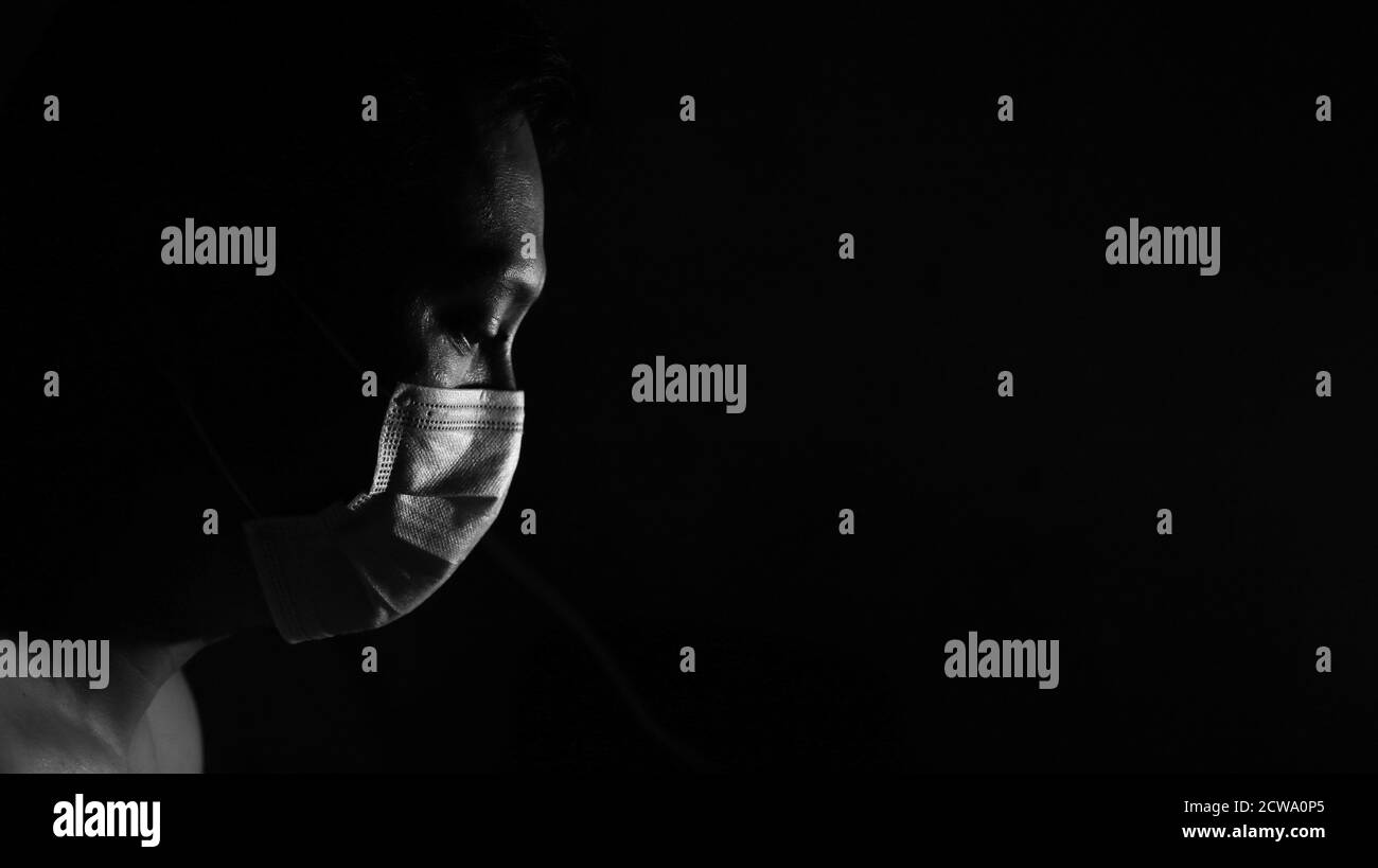 Close up wearing surgical mask Black and White Stock Photos & Images ...