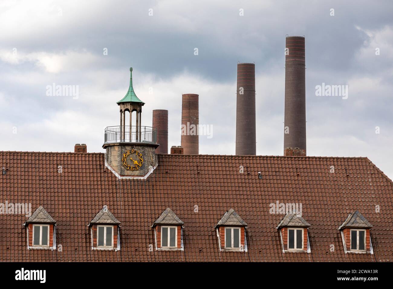 Rooftop, clock tower and car plant chimneys in Wolfsburg Stock Photo