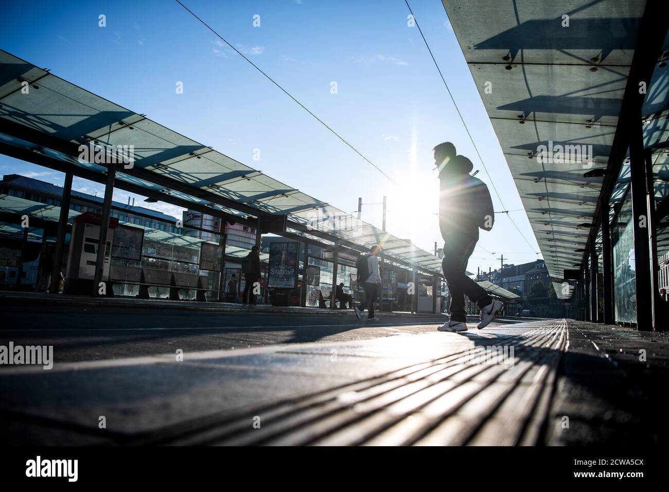 Bremen, Germany. 29th Sep, 2020. A single man walks across the empty bus stop Hauptbahnhof. The trade union Verdi has called on BSAG employees to go on a full-day warning strike. Credit: Sina Schuldt/dpa/Alamy Live News Stock Photo