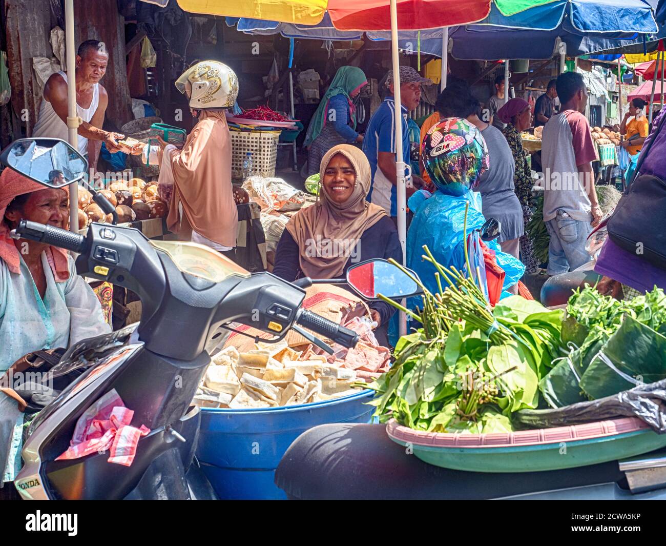 Ambon., Indonesia - Feb, 2018: Crowd of the local people selling and buying different goods on the market, Island of Ambon, Maluku, Indonesia. Asia Stock Photo