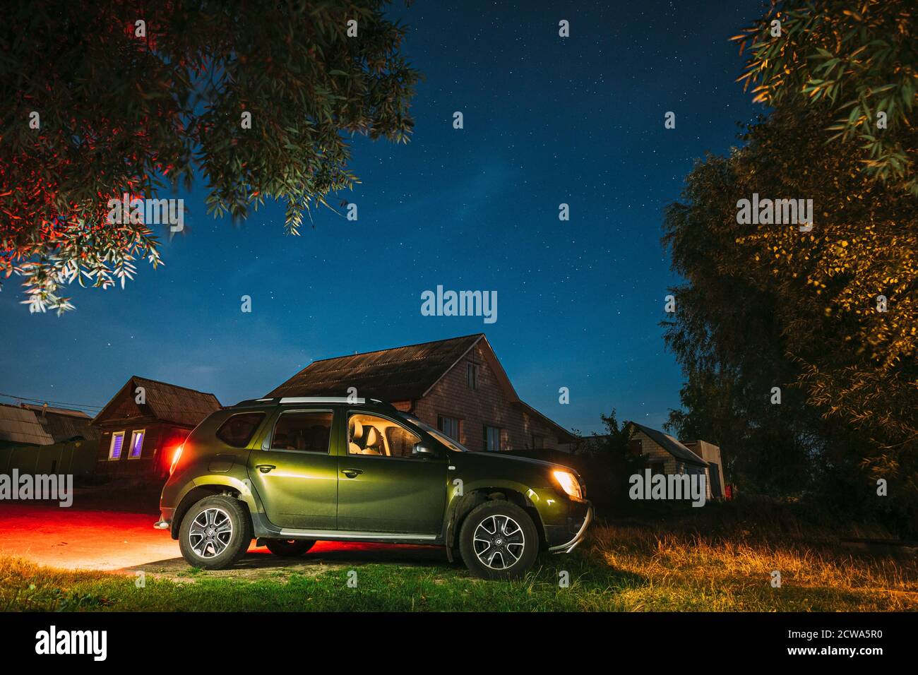 Dobrush, Belarus. Renault Duster Suv Car Parking On Street Under Night ...