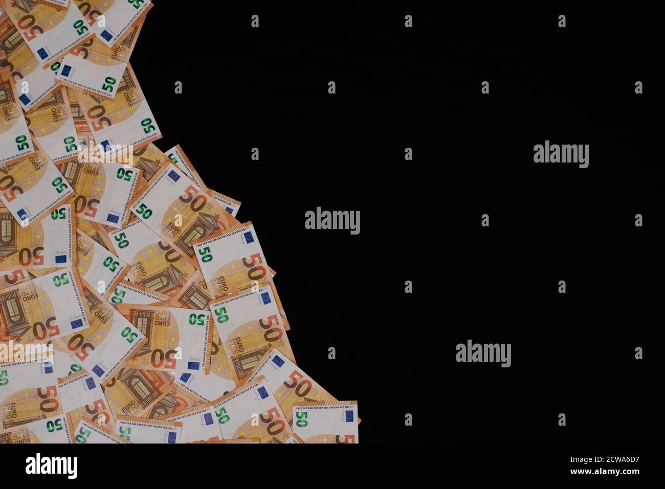 A lot of 50 euro banknotes spread out over the floor. You can use this as a unique background. Also copy space available. Stock Photo