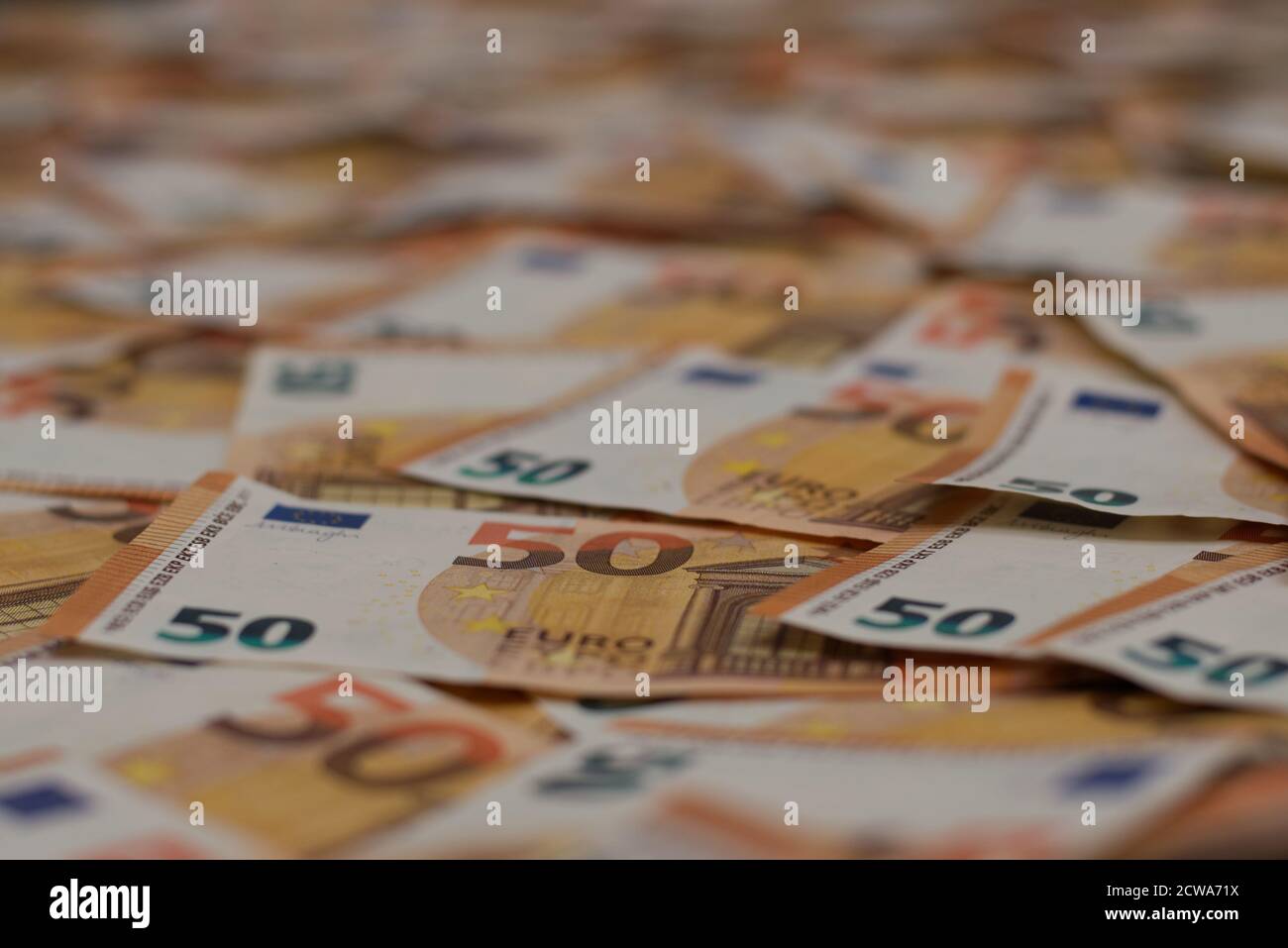 A lot of 50 euro banknotes spread out over the floor. You can use this as a unique background. Also copy space available. Stock Photo